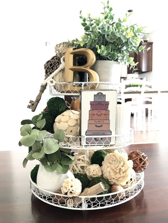 A three-tier wire tray with botanical decor