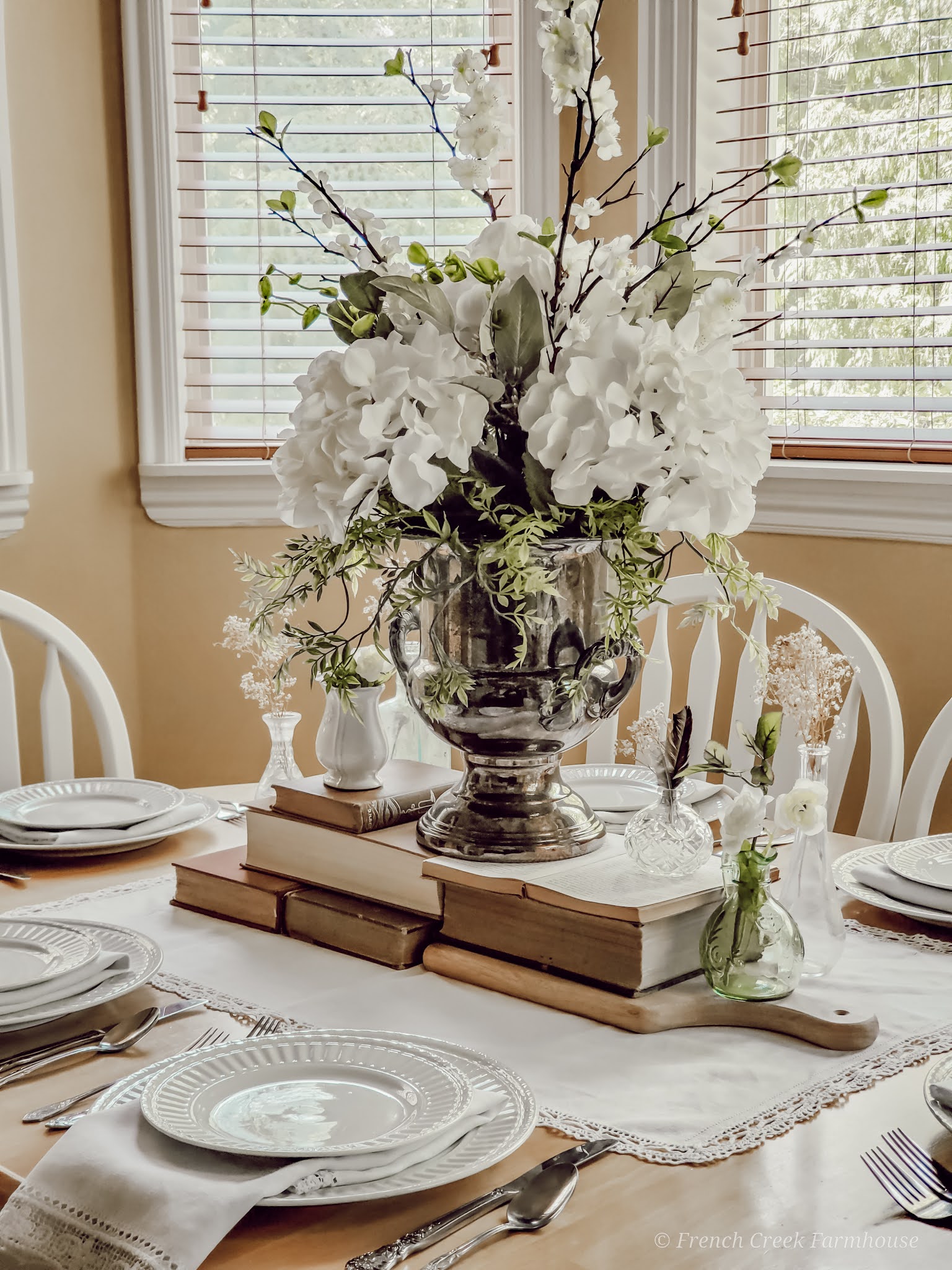Vintage Spring Tablescape Vintage champagne bucket filled with hydrangeas make a lovely centerpiece