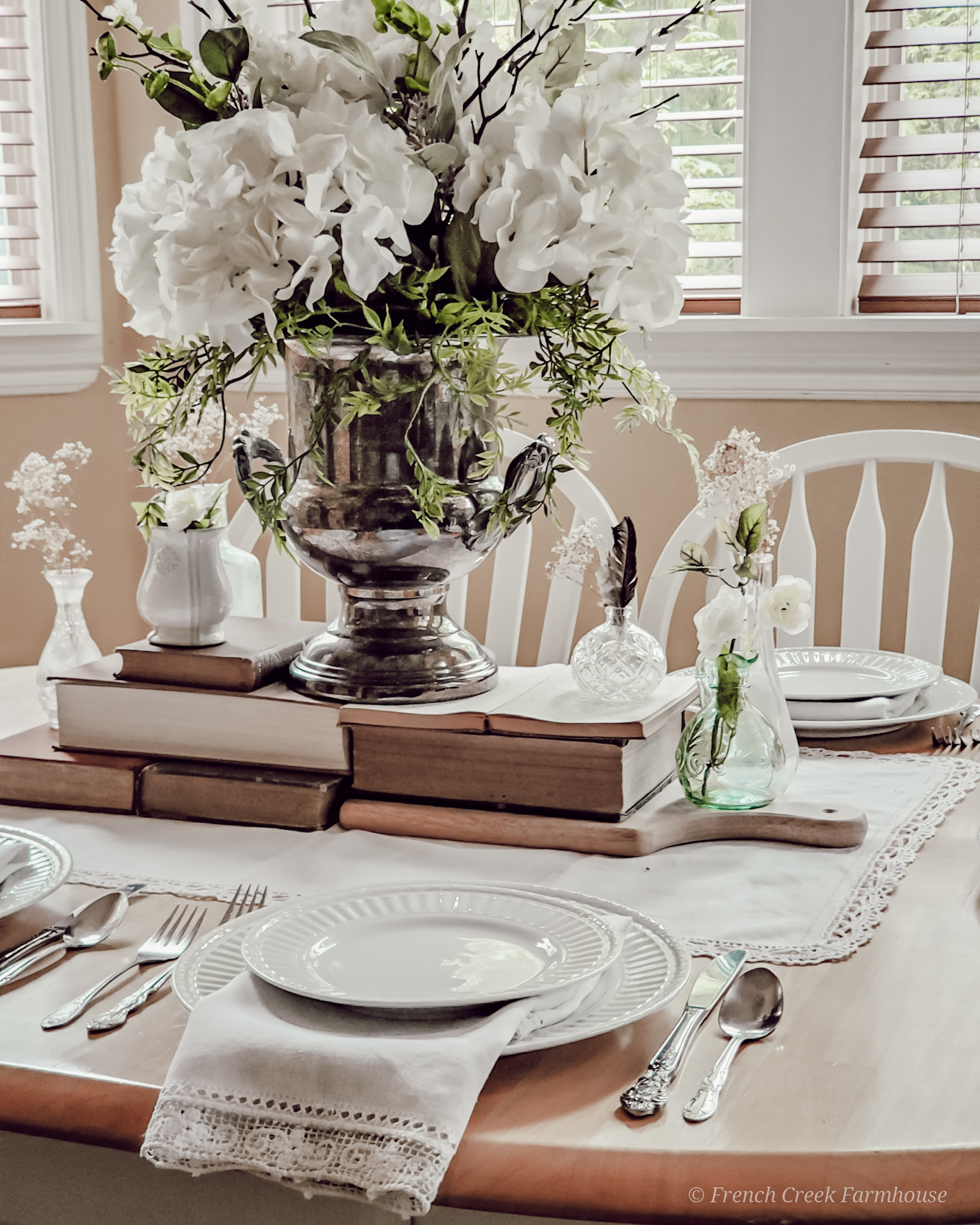 Vintage Spring Tablescape Vintage champagne buckets make wonderful vases in a French inspired centerpiece