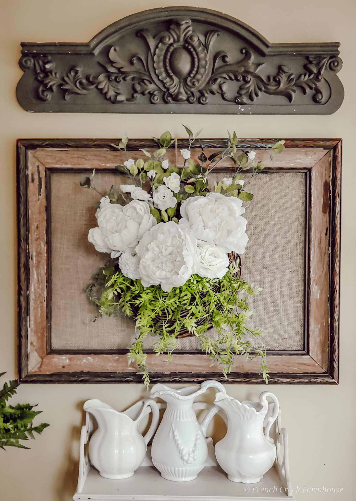 Vintage Spring Tablescape An old picture frame is a beautiful backdrop for floral arrangements