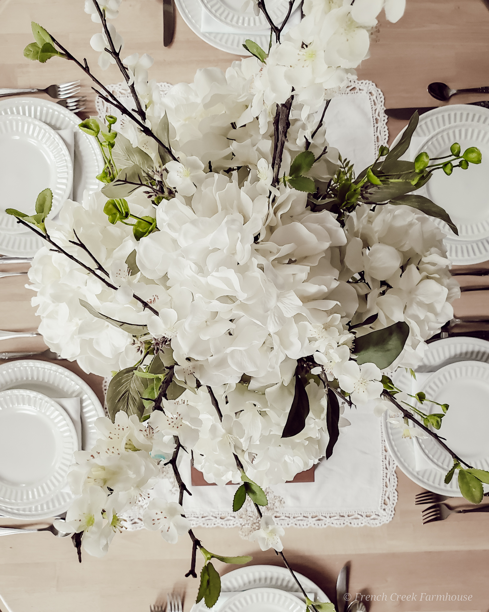 Vintage Spring Tablescape Hydrangea centerpiece on a farmhouse table