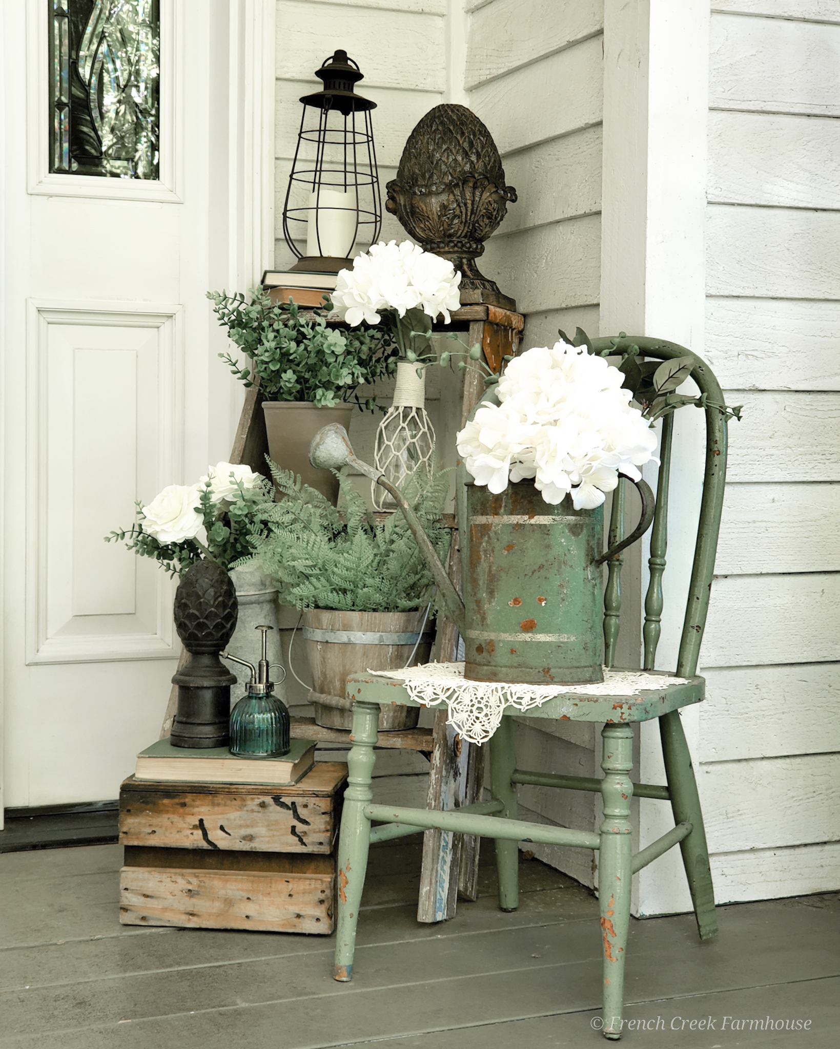 I'm using lots of spring blooms and vintage touches to decorate our porch this season