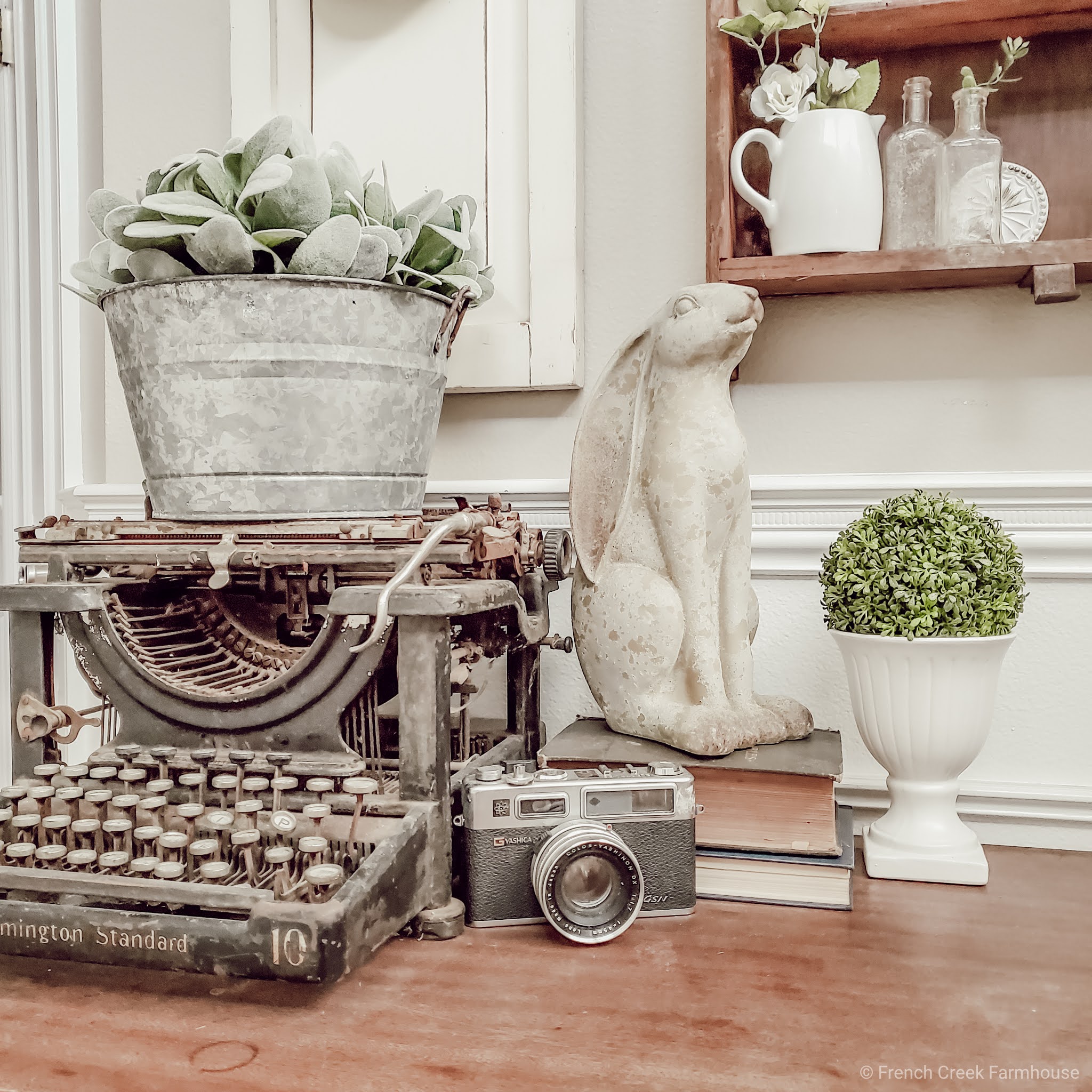 An antique typewriter is a beautiful piece of vintage decor on a console table