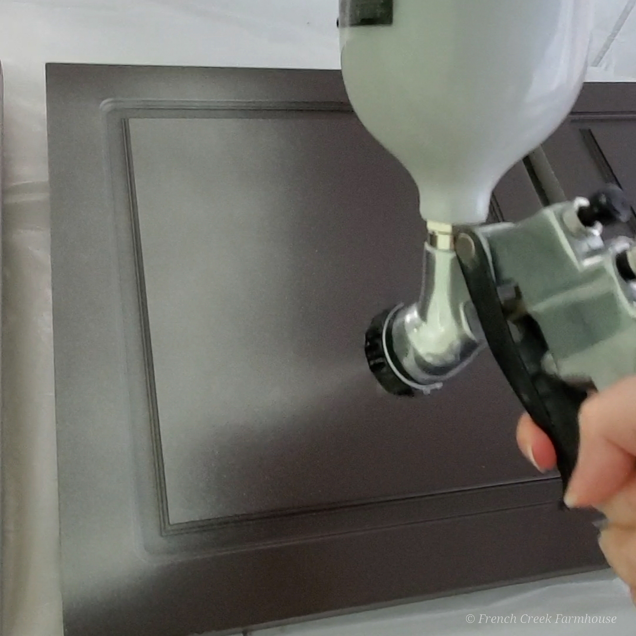 Using an HVLP gravity fed spray gun makes a smooth and professional finish