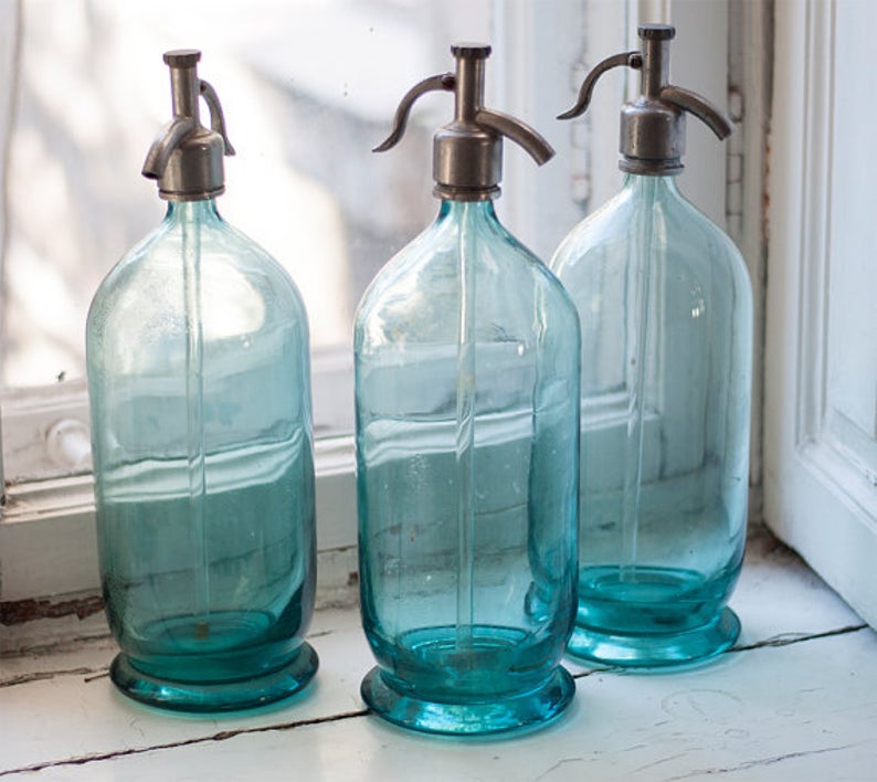 A collection of Soviet-era vintage blue glass seltzer bottles
