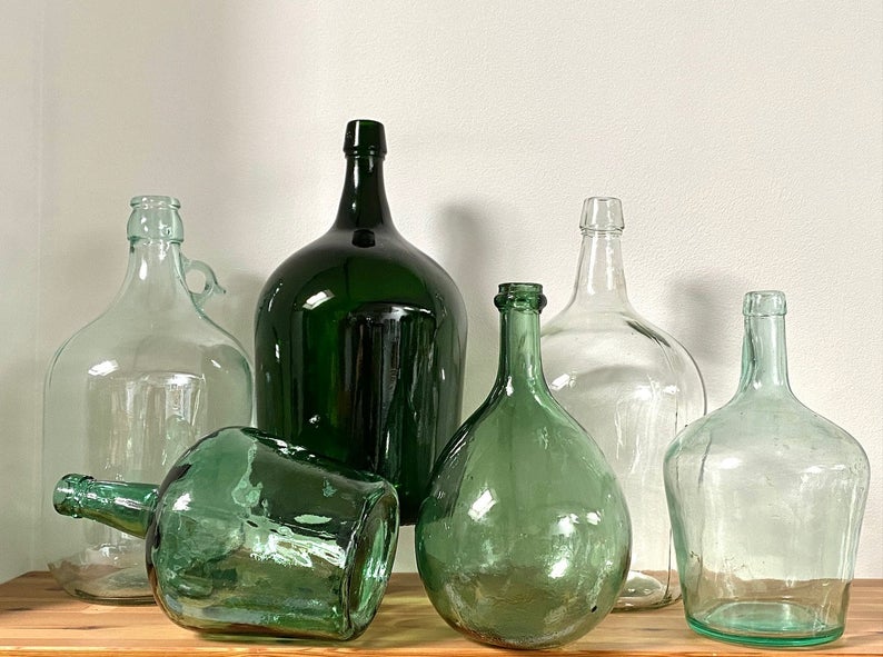A collection of vintage glass carboys