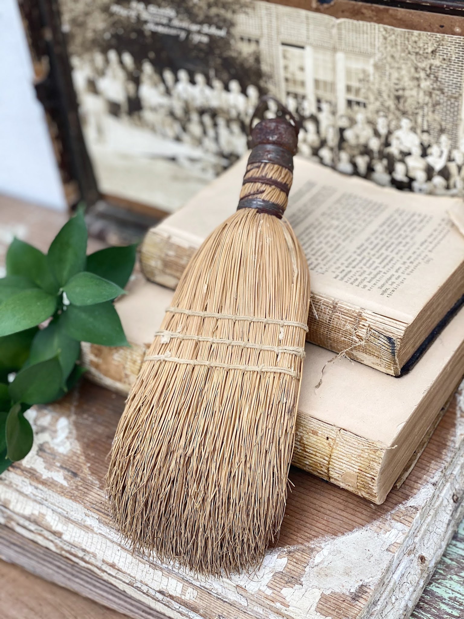 A vintage whisk broom looks great on a wall or in a bowl