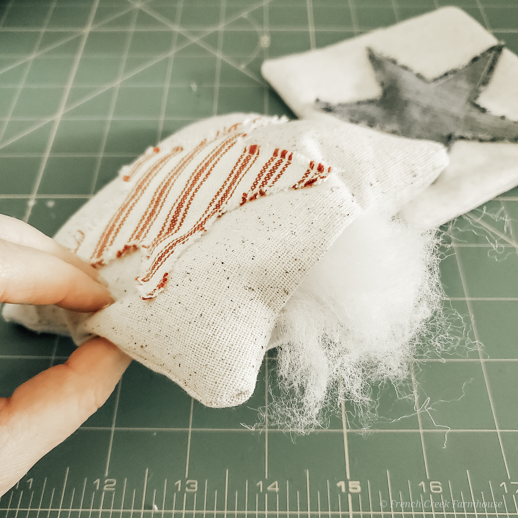 DIY Patriotic Grain Sack Tuck Pillows Step 10: Stuff pillow