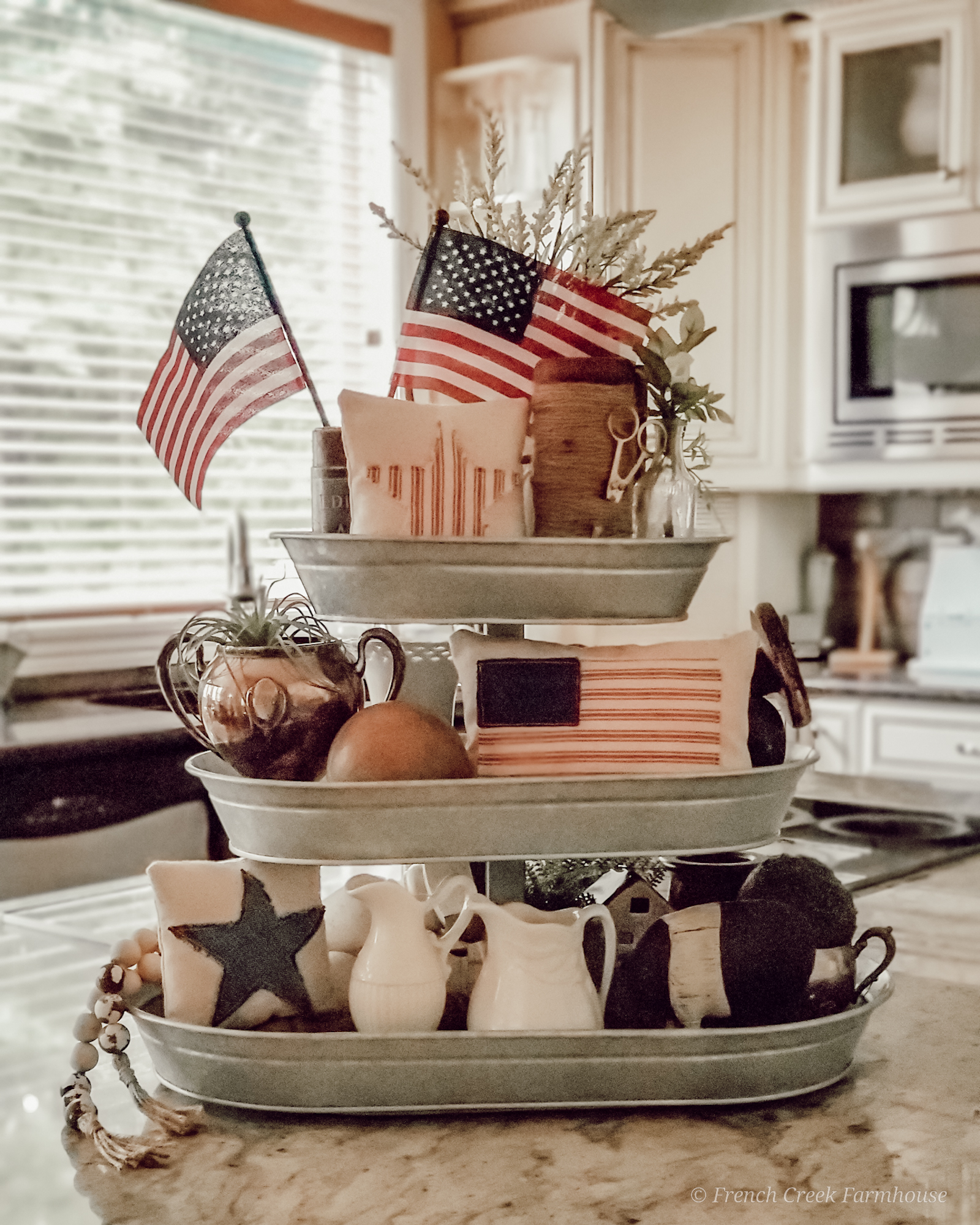 3-Tiered tray with patriotic decor on kitchen island
