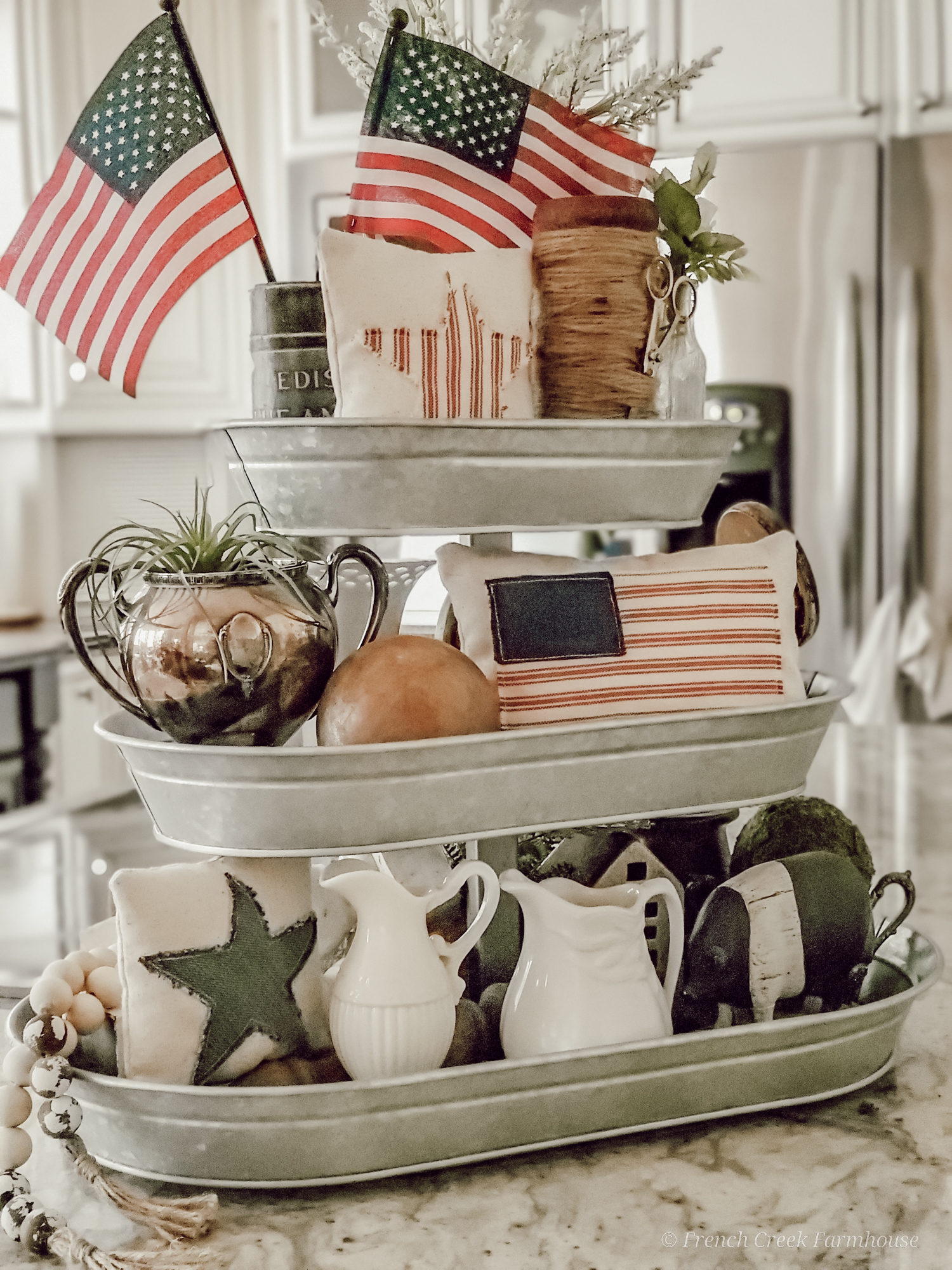Patriotic themed tiered tray on kitchen island