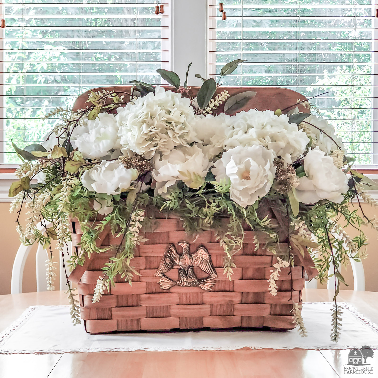 Vintage picnic basket floral arrangement