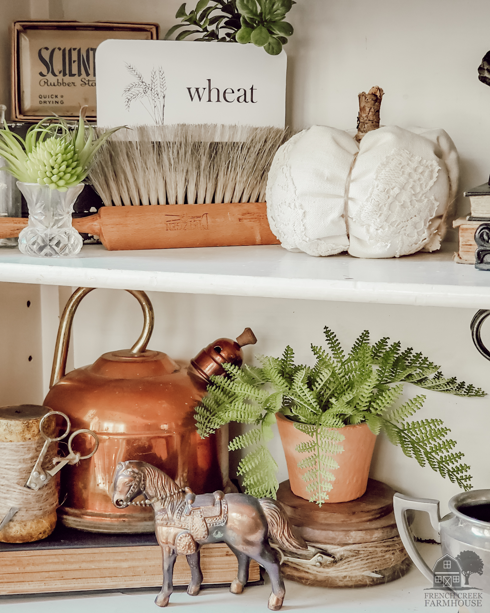 Copper tea kettles and neutral vintage items fill our farmhouse shelves