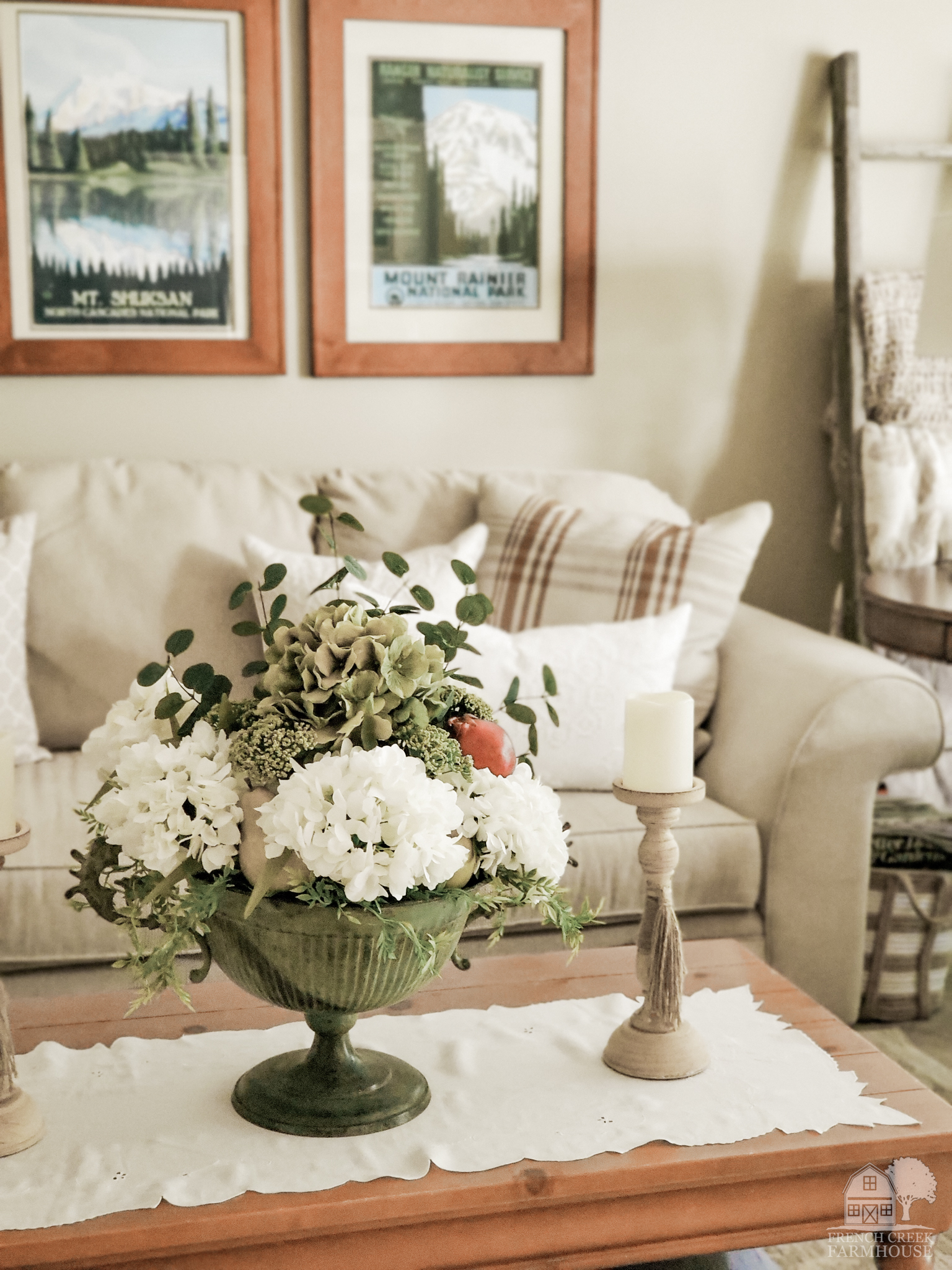 Cozy pillows and fall florals decorate our living room