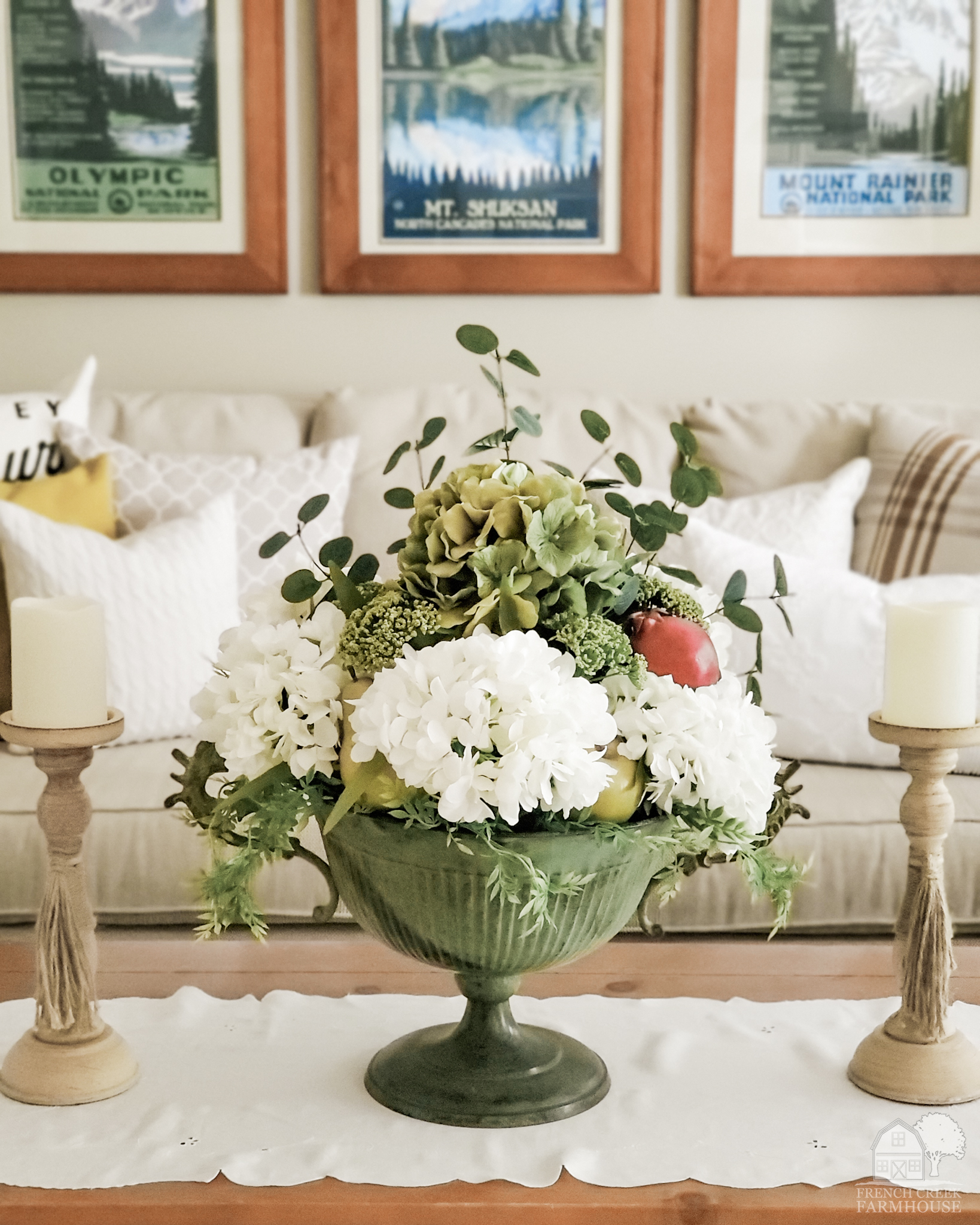 Creamy hydrangeas fill a vintage pedestal bowl