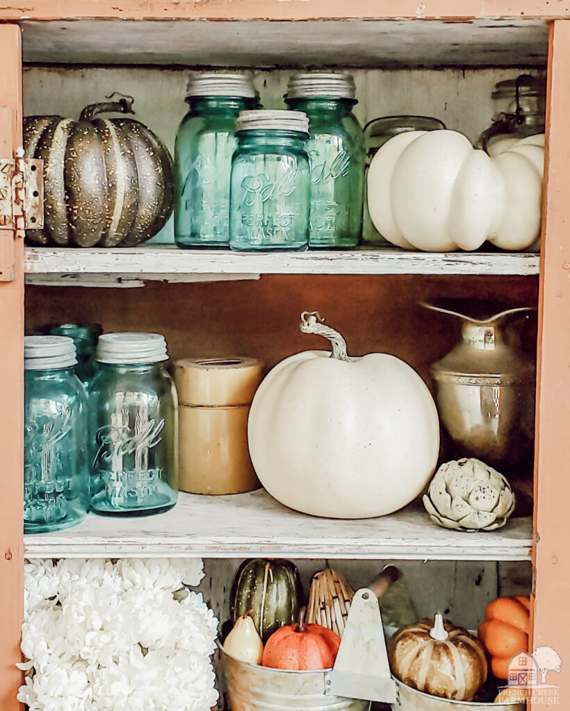 Chippy vintage shelves decorated for fall
