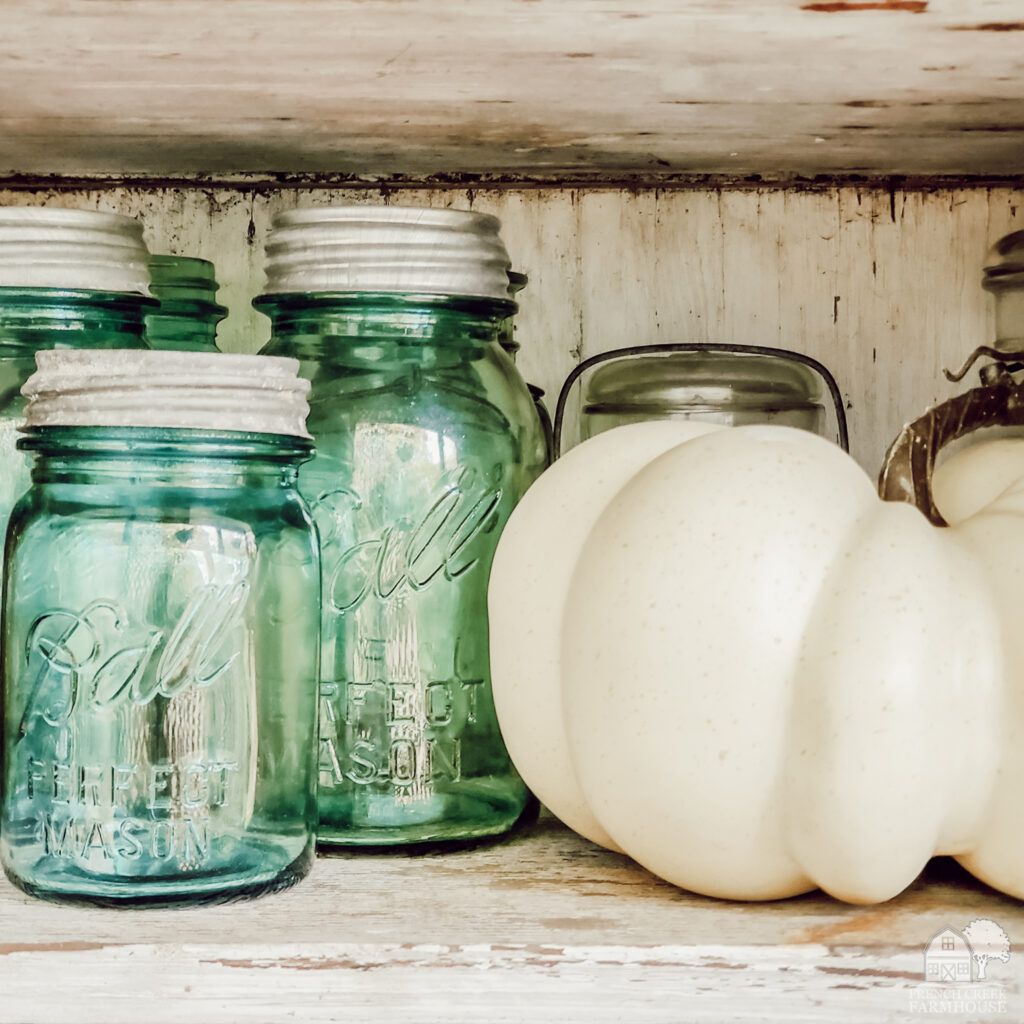 Vintage blue mason jars with fall pumpkins