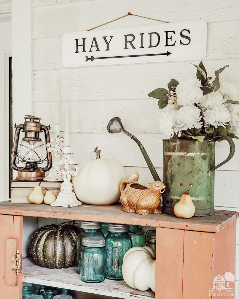 Jelly cupboard with vintage mason jars and fall decor