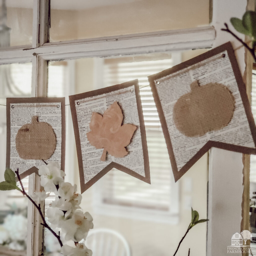 A neutral bunting banner for autumn looks beautiful strung across a window
