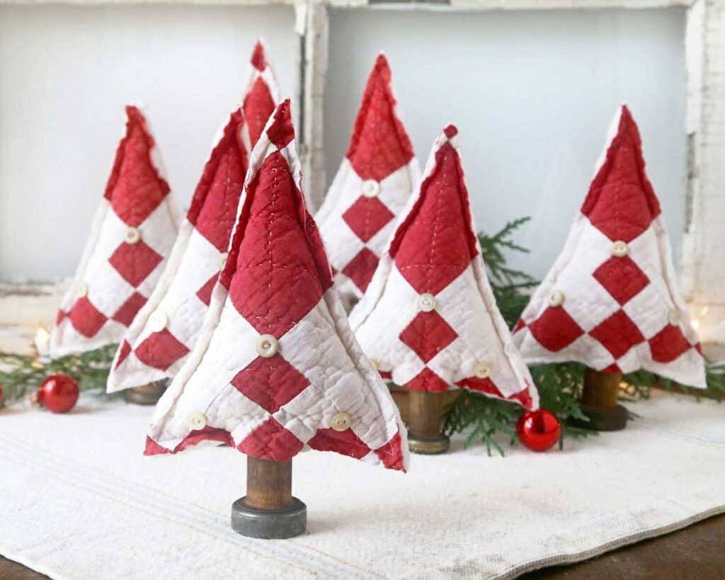 Christmas trees made from vintage quilts and wooden spools