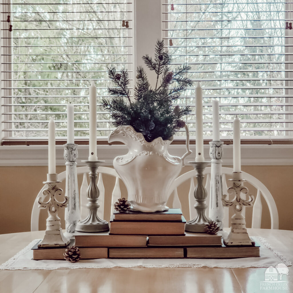 Farmhouse tablescape for winter with vintage books and candles