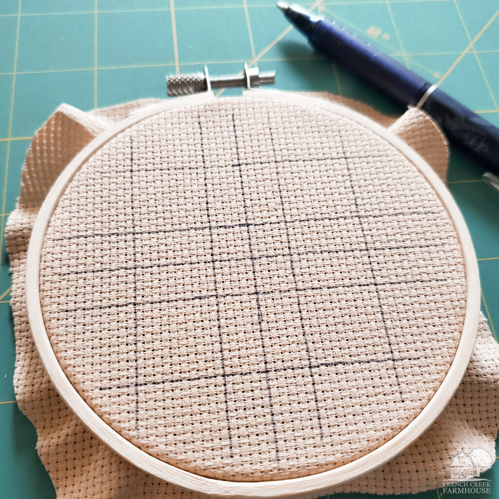 Preparing fabric to begin cross-stitching