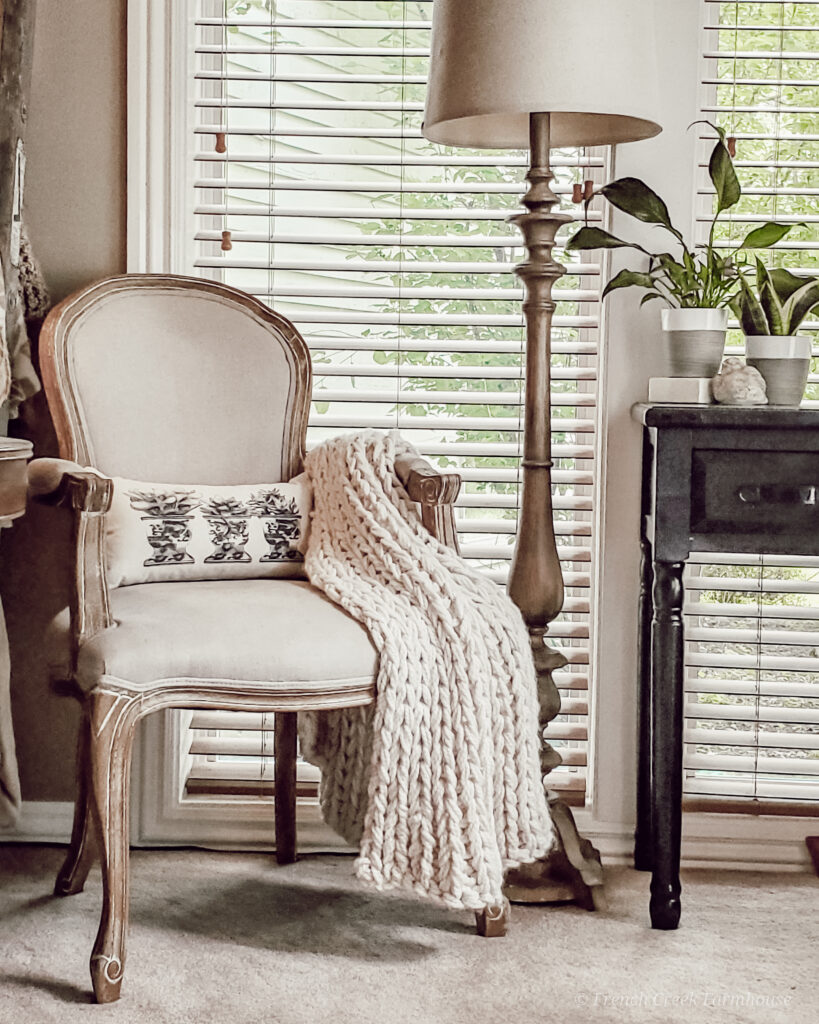 A French Country chair with botanical themed pillow adds a perfect springtime touch