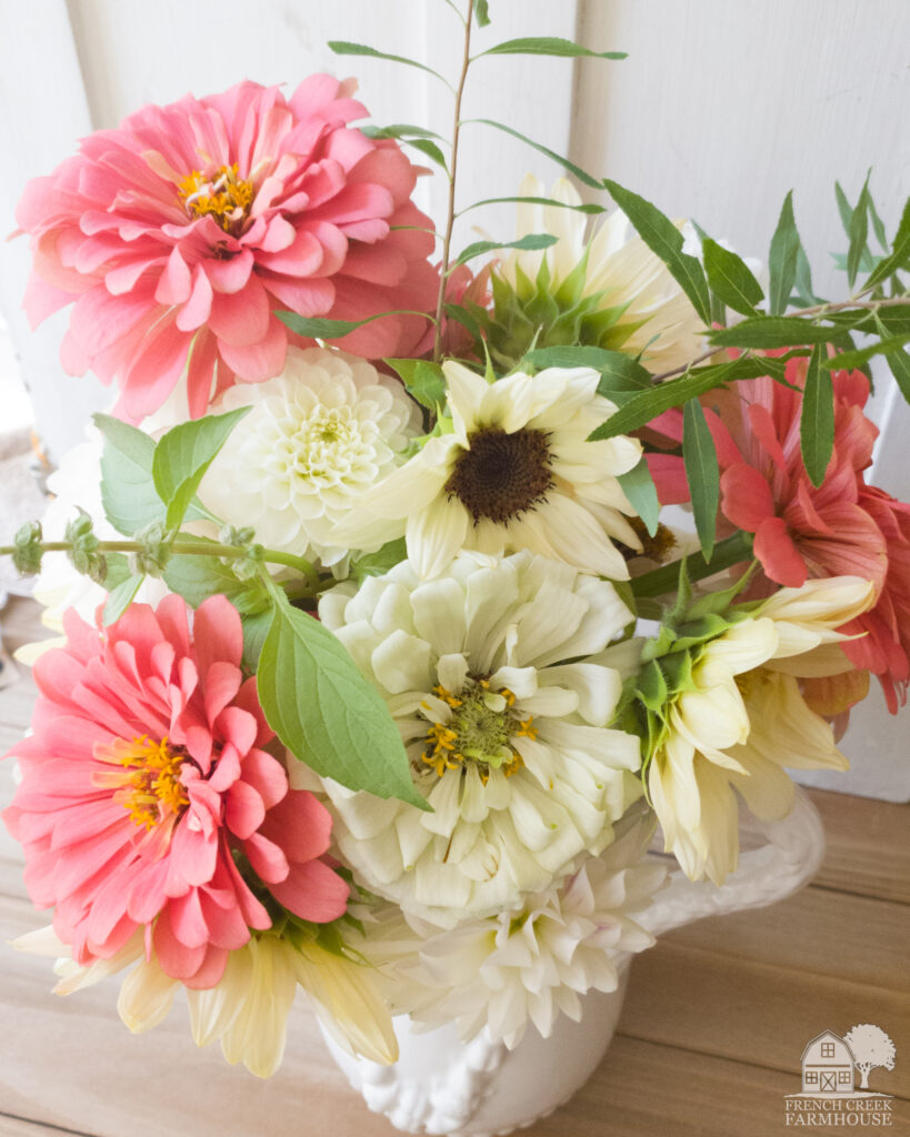 Zinnias and sunflowers are a beautiful complement to our dahlias