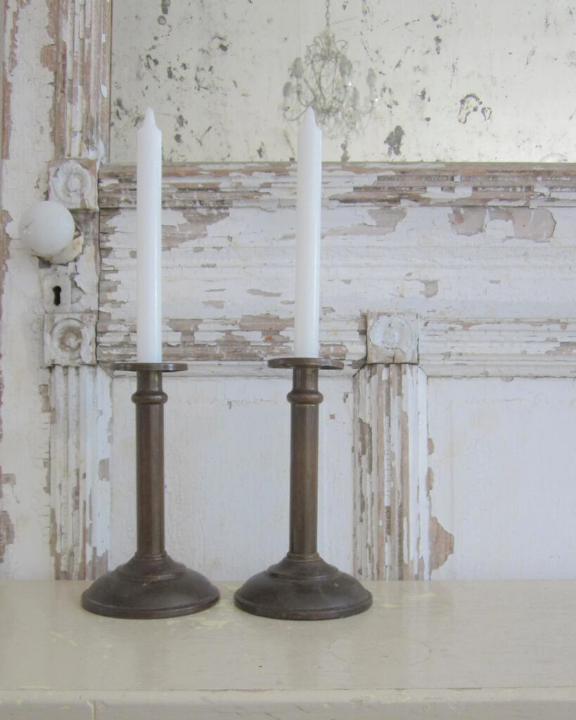 A simple pair of vintage brass candlesticks exude understated elegance for fall.