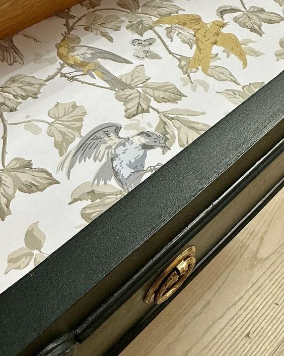 Decorative paper is a beautiful way to line drawers in refinished furniture for a professional touch.