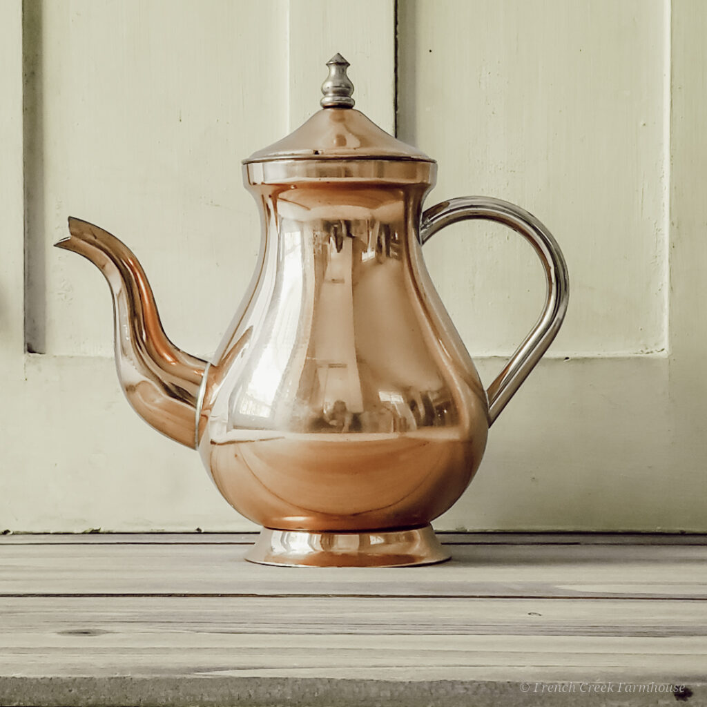 Copper kettles, with their warm metallic sheen and old-world charm, are perfect for vintage fall decor.