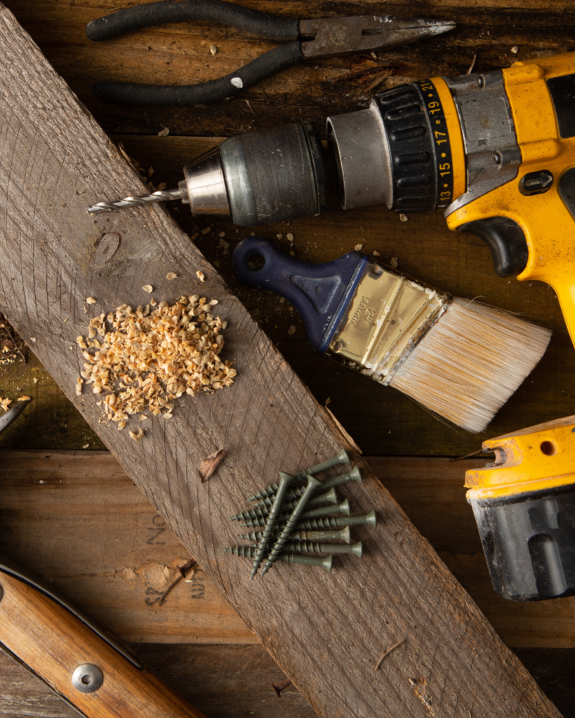 A reclaimed wood drill handled toolbox of many talents