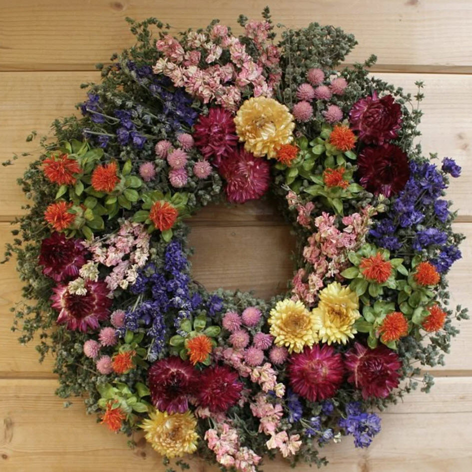 Absolutely loaded with blooms, this wreath features marjoram, savory, larkspur, safflower, strawflower, and globe amaranth.
