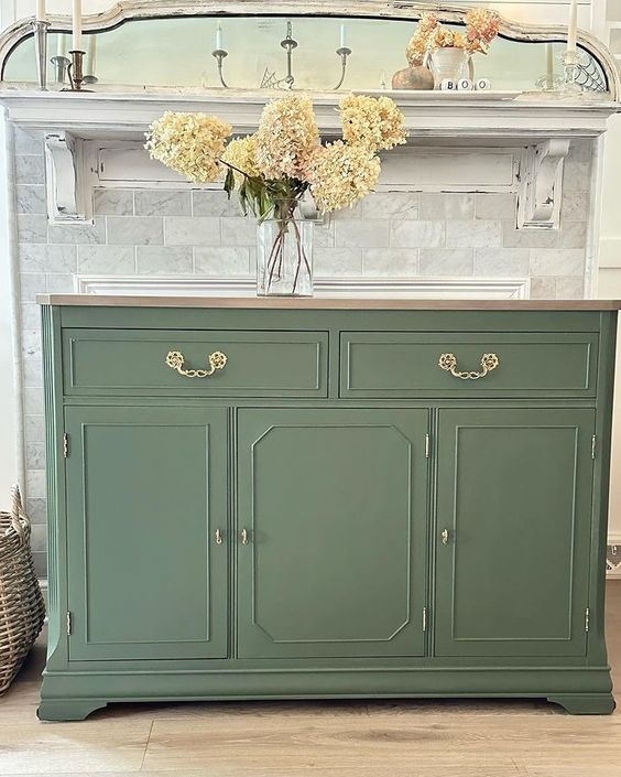 The color of green on this sideboard gives a vintage feel while still modernizing the piece over its previous dark and glossy finish.