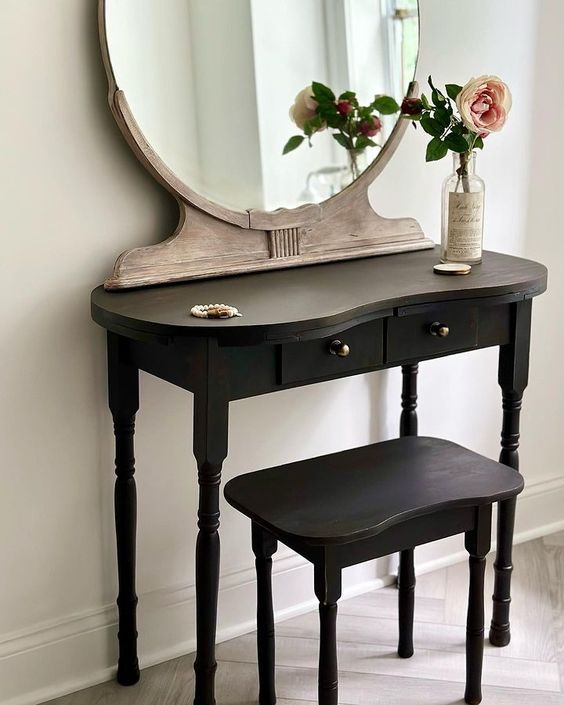 A beautifully refinished vanity set made possible with a simple coat of black paint!