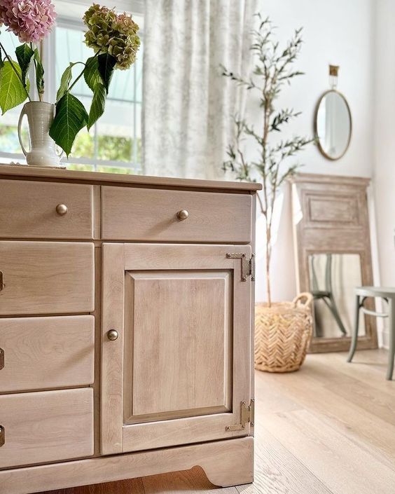 Beautiful blonde bare wood is currently on trend, and you can refinish wood furniture to save your budget versus buying new!