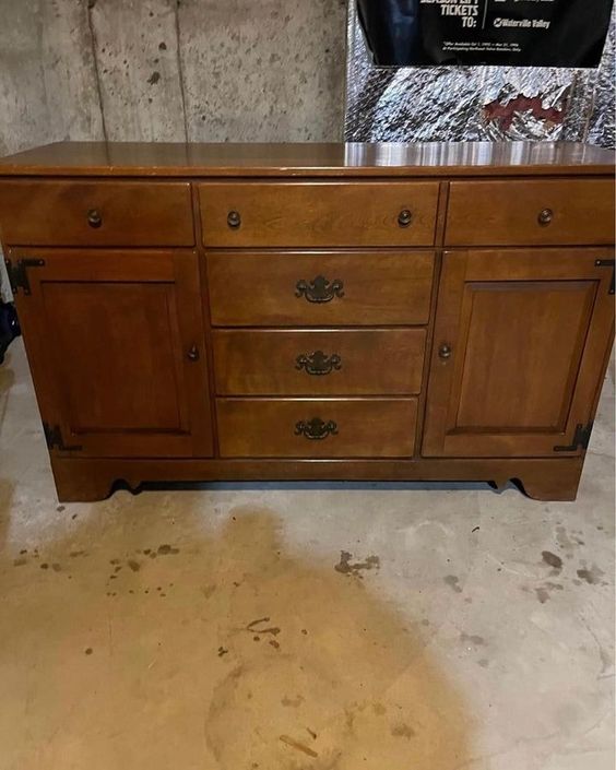 This is a dated piece that many wouldn't consider worth saving, but a new finish and minor updates to the lower trim and hardware make a stunning difference!