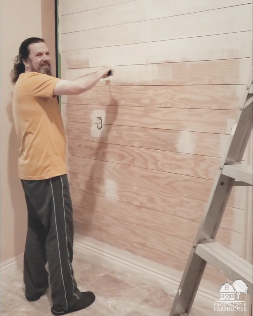 Installing a faux shiplap wall is an easy weekend DIY!