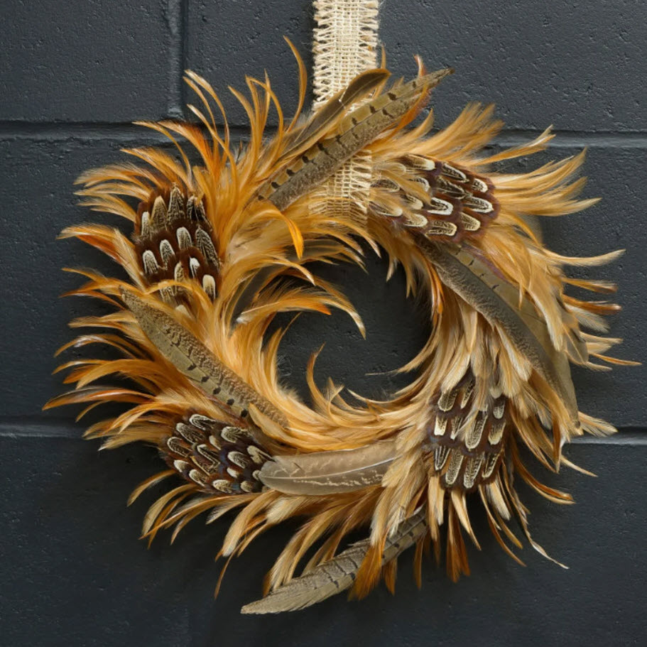 Incorporating both the colors and textures of autumn, this unconventional wreath of pheasant feathers is sure to earn you plenty of compliments.