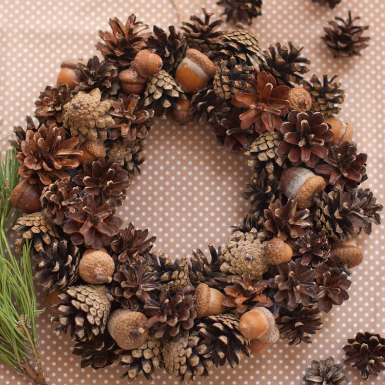 Get your nest cozy for autumn with a wreath made from natural pinecones and acorns.