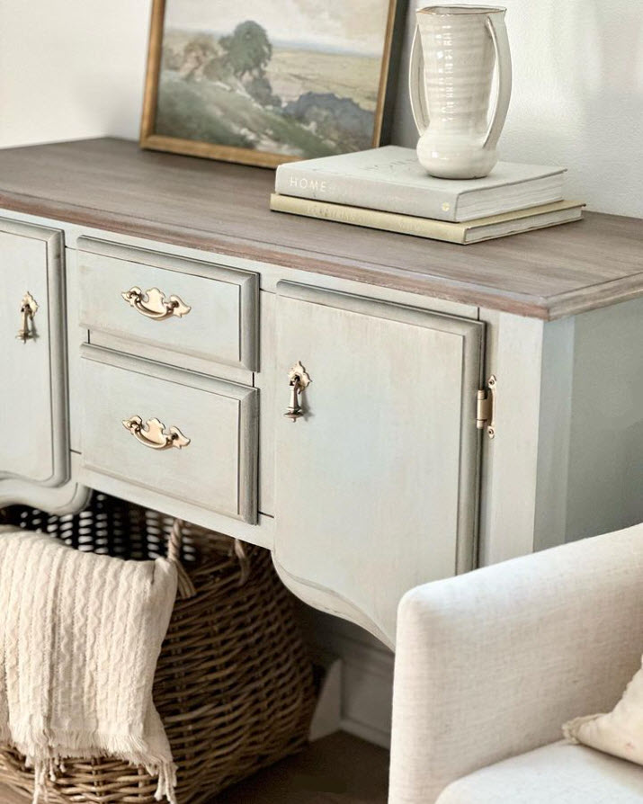 Painted in the dreamiest French blue and antiqued with a newly refinished provincial stain on top, this buffet was given new life!