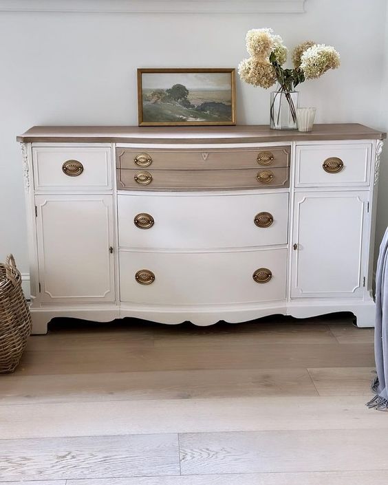 A combination of paint and bare wood makes a beautiful statement on this refinished sideboard.