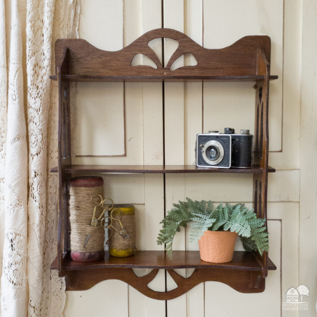 A petite vintage wooden shelf makes a wonderful place to display treasured finds