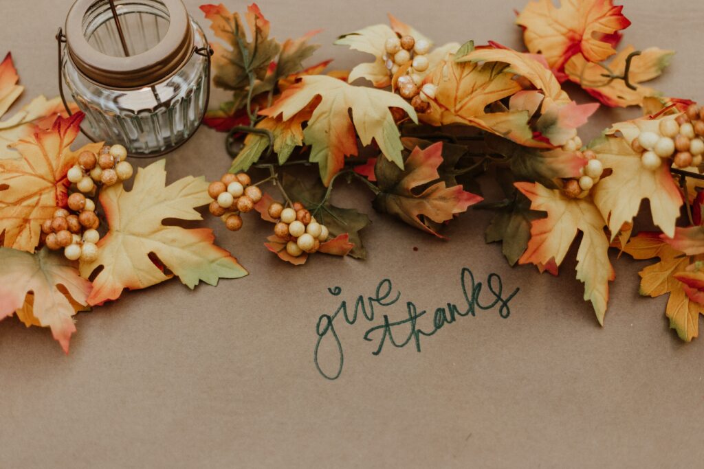Using kraft paper on tables creates a unique setting for guests to reflect on gratitude over Thanksgiving dinner.