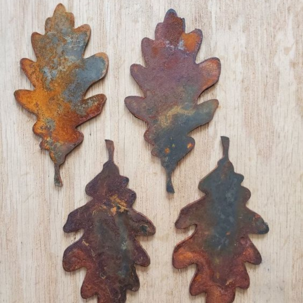 Rusted metal oak leaf silhouettes