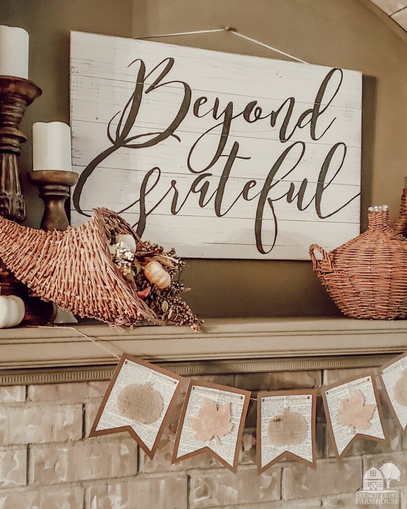 Keeping a neutral color palette for our Thanksgiving mantel means that I try to use shades of brown, ivory, and only a few hints of color through items with a natural patina that matches autumn's leaves.