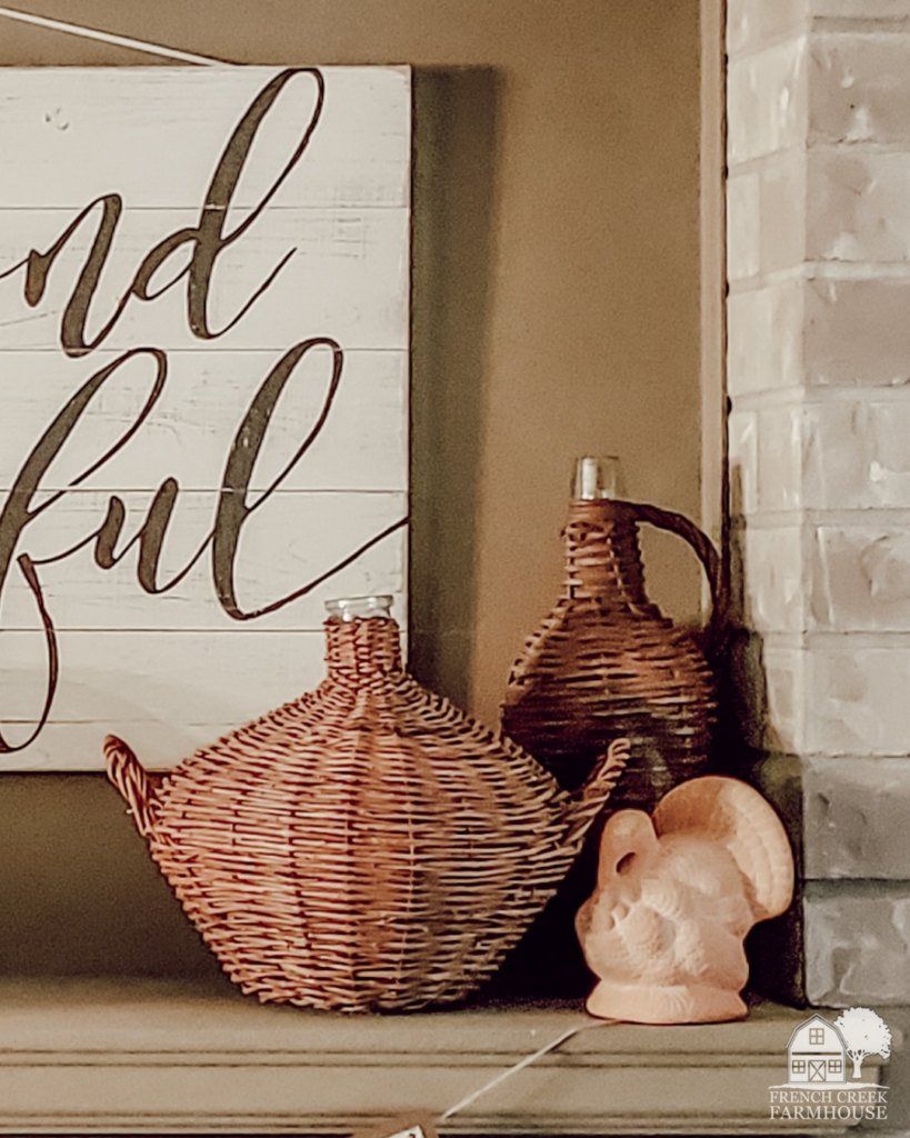 The vintage terracotta turkey on our Thanksgiving mantel is a prime example of how to add subtle autumn color without going over the top.