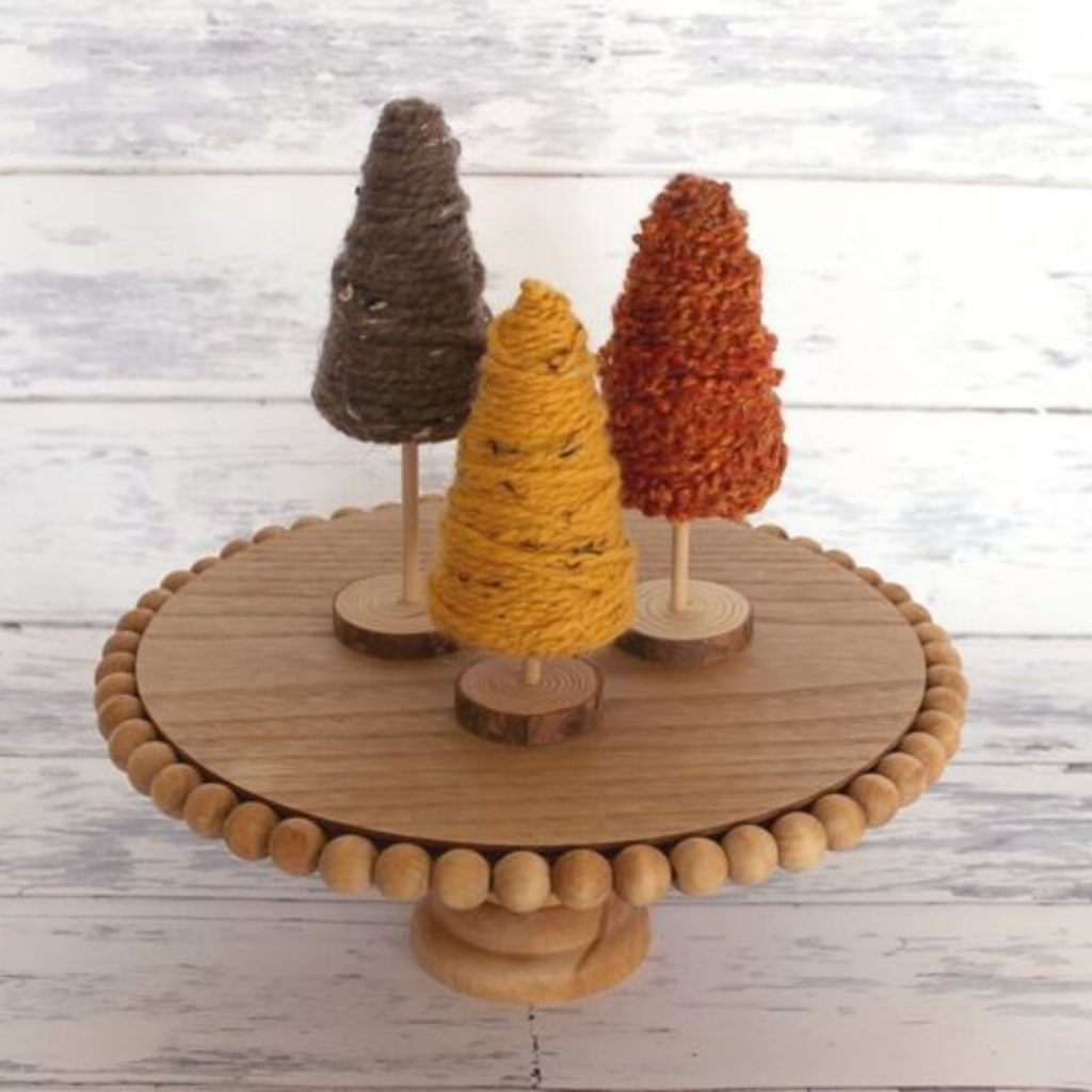 Trio of mini yarn-wrapped trees in autumn colors