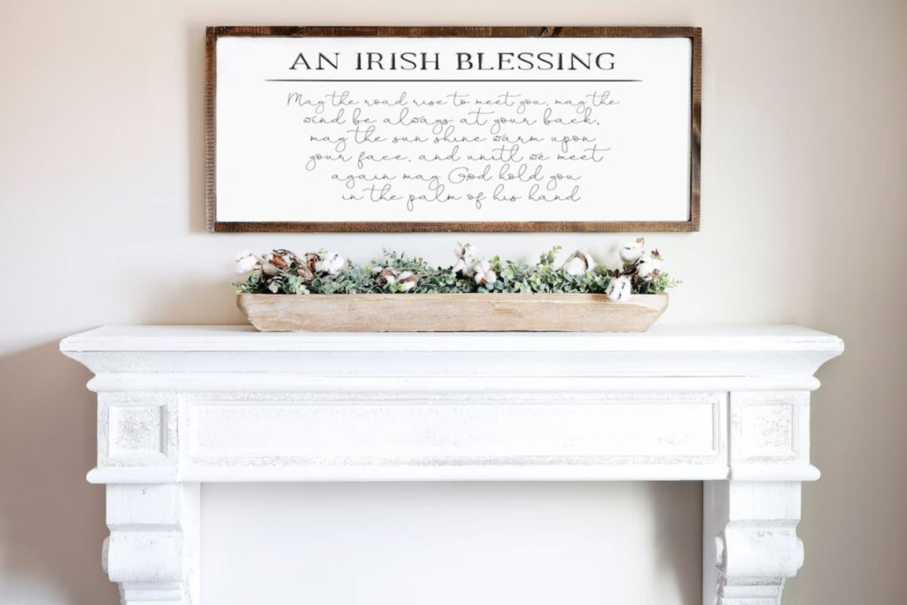 Rustic wood framed sign with an Irish blessing above a fireplace mantel