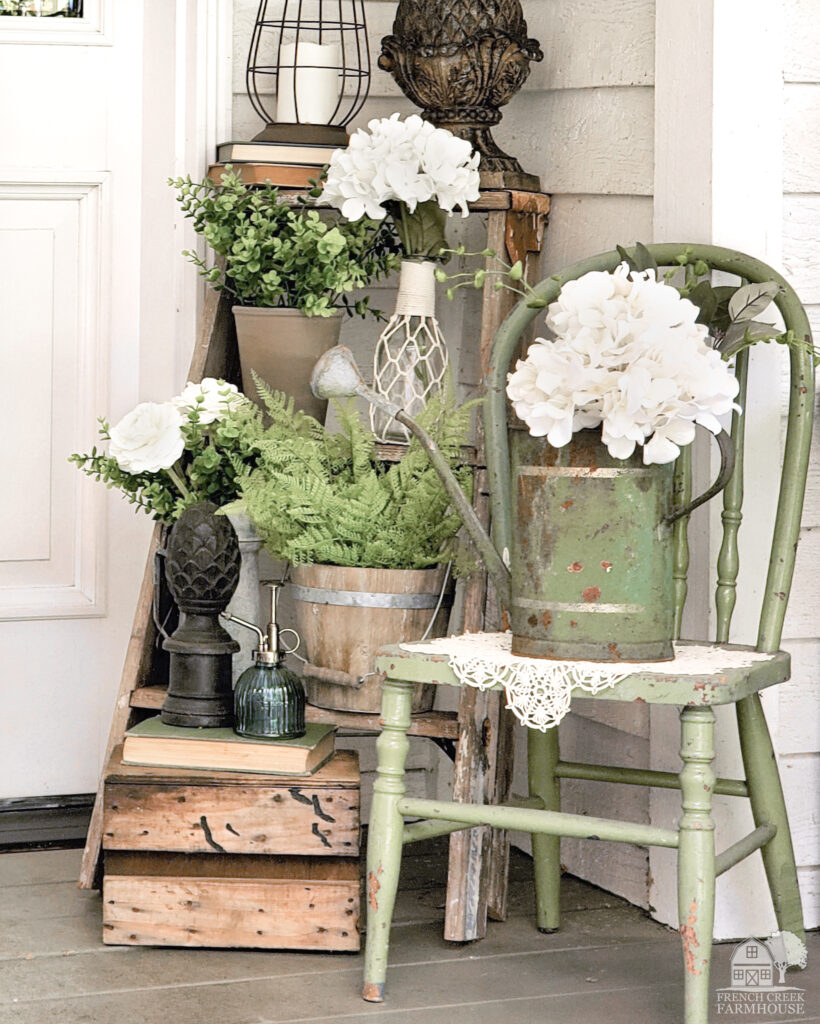Our front porch includes vintage items in shades of green to welcome spring and St. Patrick's Day