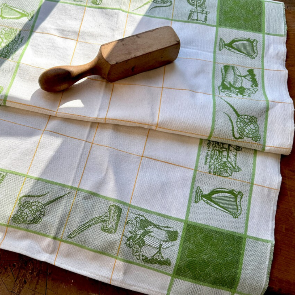 Vintage green tea towel with Irish images